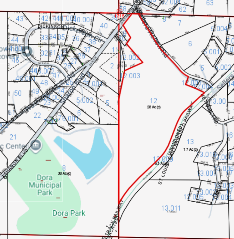 Tax parcel map with parcel 12 outlined in red near Dora Municipal Park and local roads